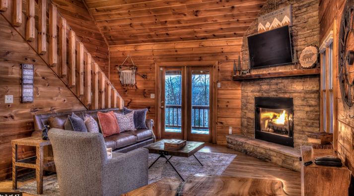 348 The Forest Has Eyes Blue Ridge, GA 30513 - Photo 19 of 49 a living room with furniture and a fireplace