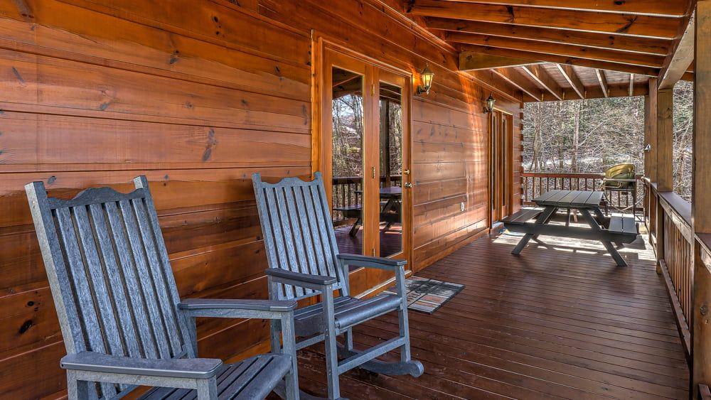 348 The Forest Has Eyes Blue Ridge, GA 30513 - Photo 22 of 49 a view of balcony with wooden floor and outdoor seating