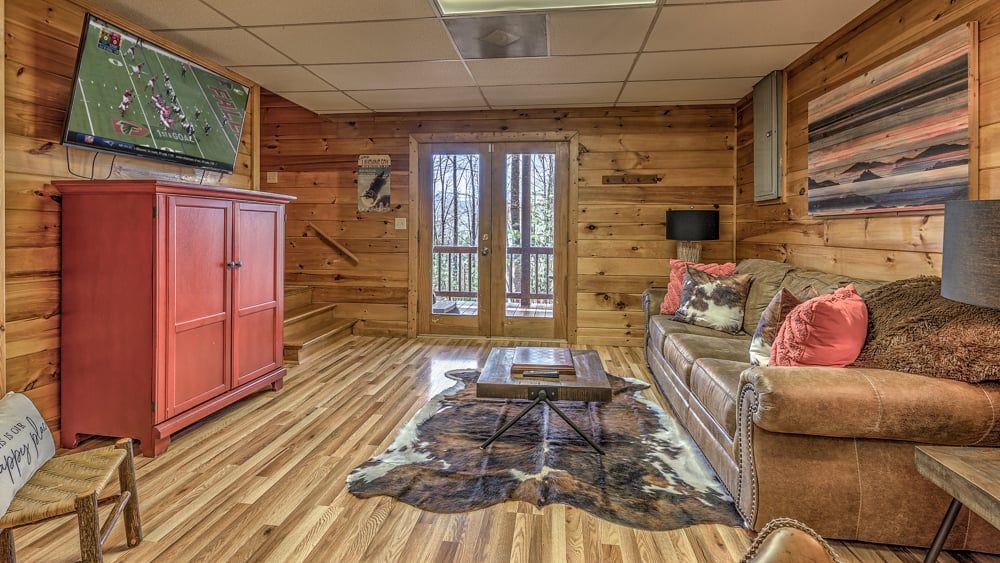 348 The Forest Has Eyes Blue Ridge, GA 30513 - Photo 29 of 49 a living room with furniture and a wooden floor