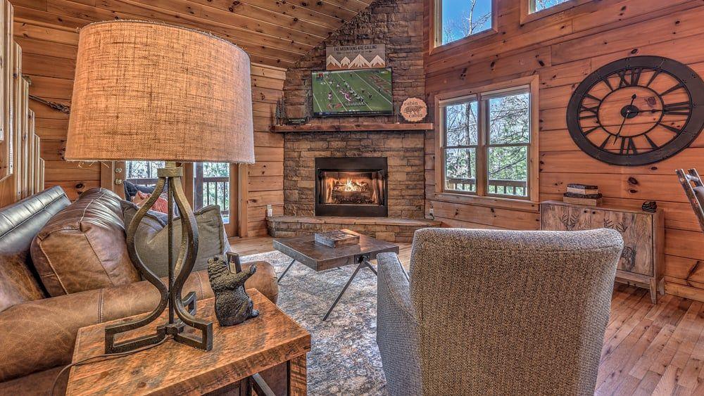 348 The Forest Has Eyes Blue Ridge, GA 30513 - Photo 38 of 49 a living room with furniture a window and a fireplace