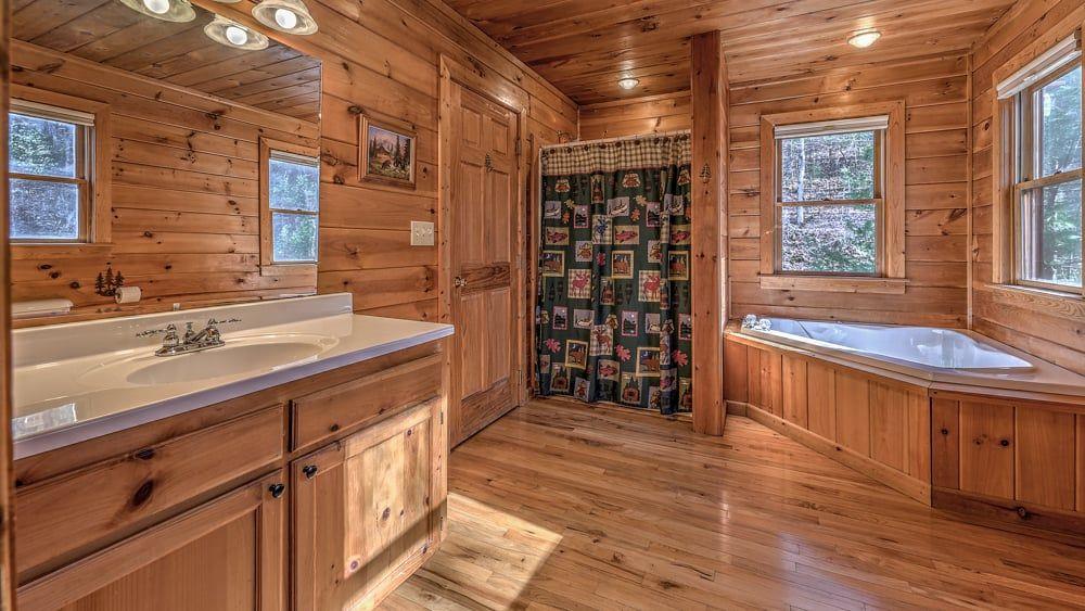 348 The Forest Has Eyes Blue Ridge, GA 30513 - Photo 41 of 49 a spacious bathroom with double vanity and a bathtub