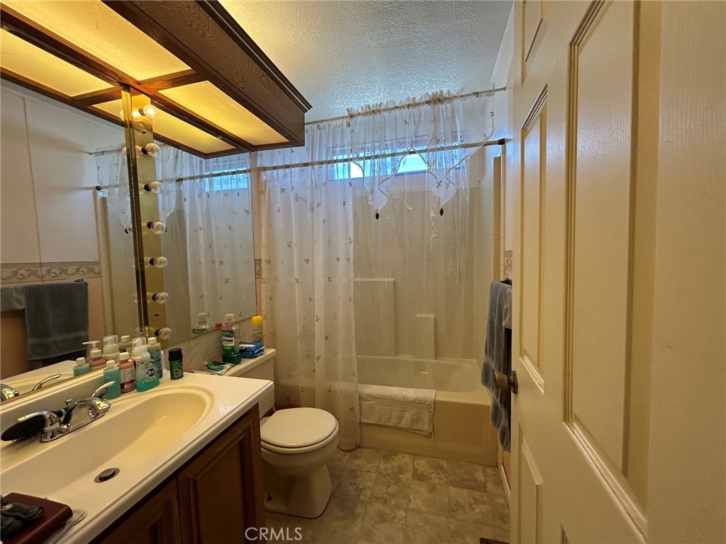 27250 Murrieta Road, Unit 347 Menifee, CA 92586 - Photo 24 of 39 a bathroom with a sink mirror toilet and shower