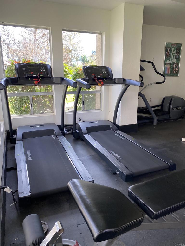 230 Diamond Way, Unit 148 Vista, CA 92083 - Photo 17 of 18 a room with gym equipment and a large window