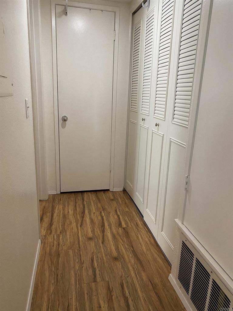 230 Diamond Way, Unit 148 Vista, CA 92083 - Photo 6 of 18 a view of a room with wooden floor and staircase