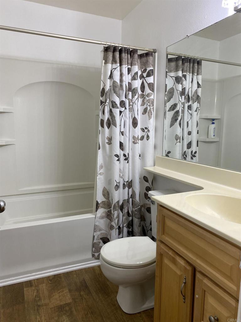 230 Diamond Way, Unit 148 Vista, CA 92083 - Photo 10 of 18 a bathroom with a sink a toilet and shower