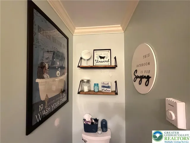 a bathroom with a walk in closet and a window