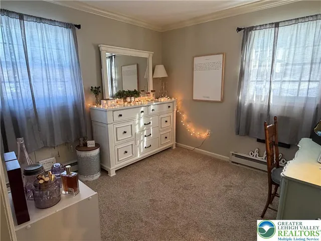 a room with a mirror and furniture