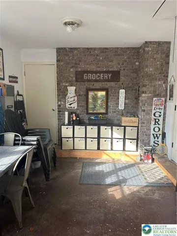 a lobby with a table and chairs