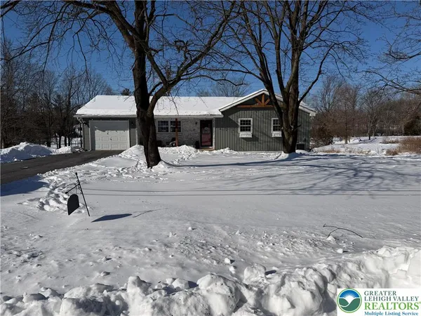 a view of a house with a snow