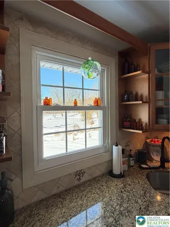 a kitchen with sink and window