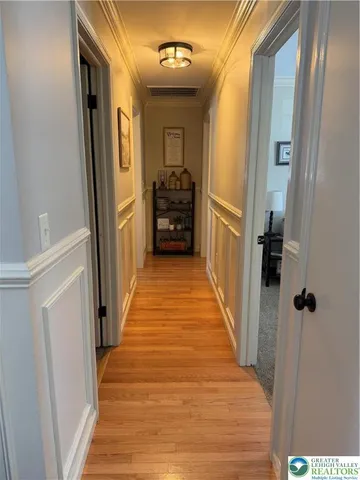 a view of a hallway view with wooden floor