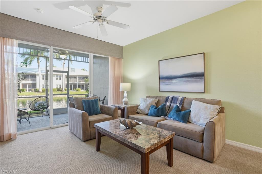 7920 Mahogany Run Lane, Unit 1015 Naples, FL 34113 - Photo 8 of 35 LIVING AREA OVERLOOKING WATER VIEWS..