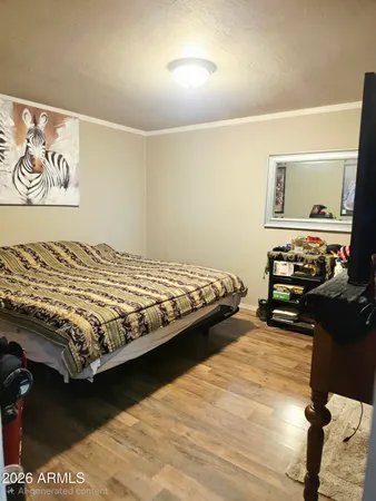 a bedroom with a bed and dresser