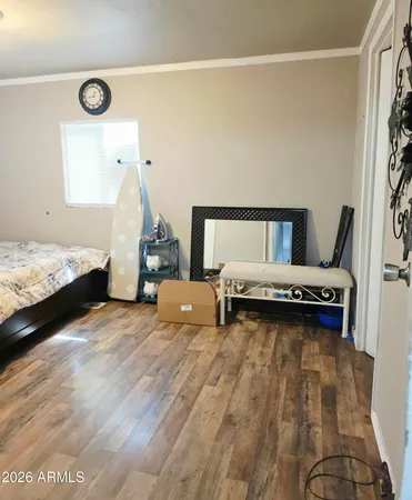 a bedroom with bed and window