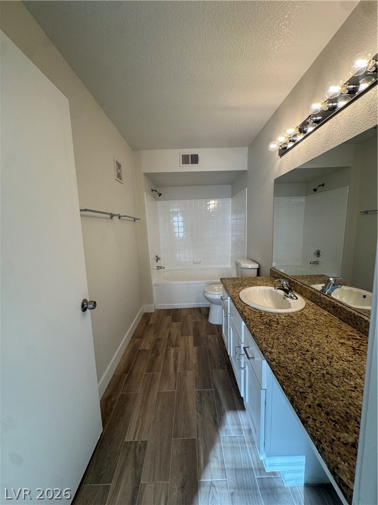 8101 West Flamingo Road, Unit 1040 Las Vegas, NV 89147 - Photo 12 of 22 This bathroom features a double vanity and sleek modern finishes, creating a refreshing atmosphere.