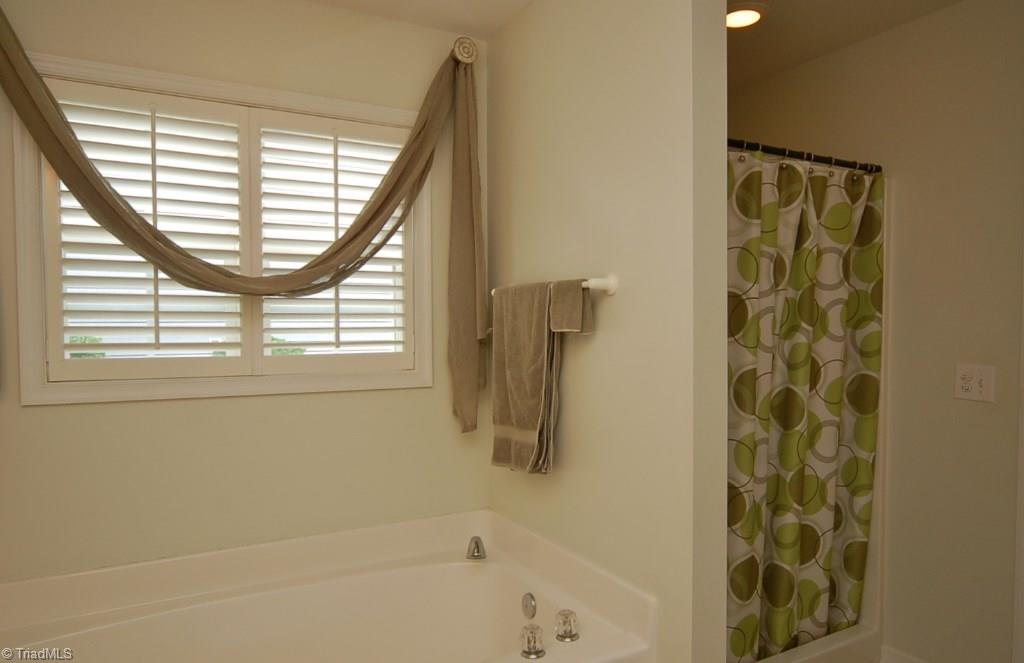3809 Payne Road High Point, NC 27265 - Photo 16 of 30 A separate walk in shower and garden tub complete the master bathroom.