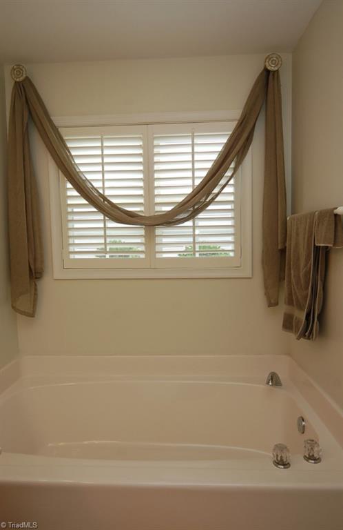 3809 Payne Road High Point, NC 27265 - Photo 17 of 30 Unwind and relax in the garden soaking tub in the master bedroom.