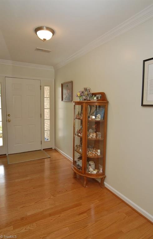 3809 Payne Road High Point, NC 27265 - Photo 3 of 30 Welcoming foyer! Home has hardwoods, carpet and tile flooring plus neutral paint.
