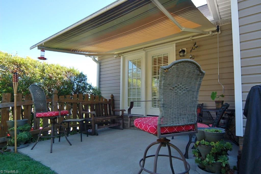3809 Payne Road High Point, NC 27265 - Photo 23 of 30 The patio space has a motorized awning that provides shade.