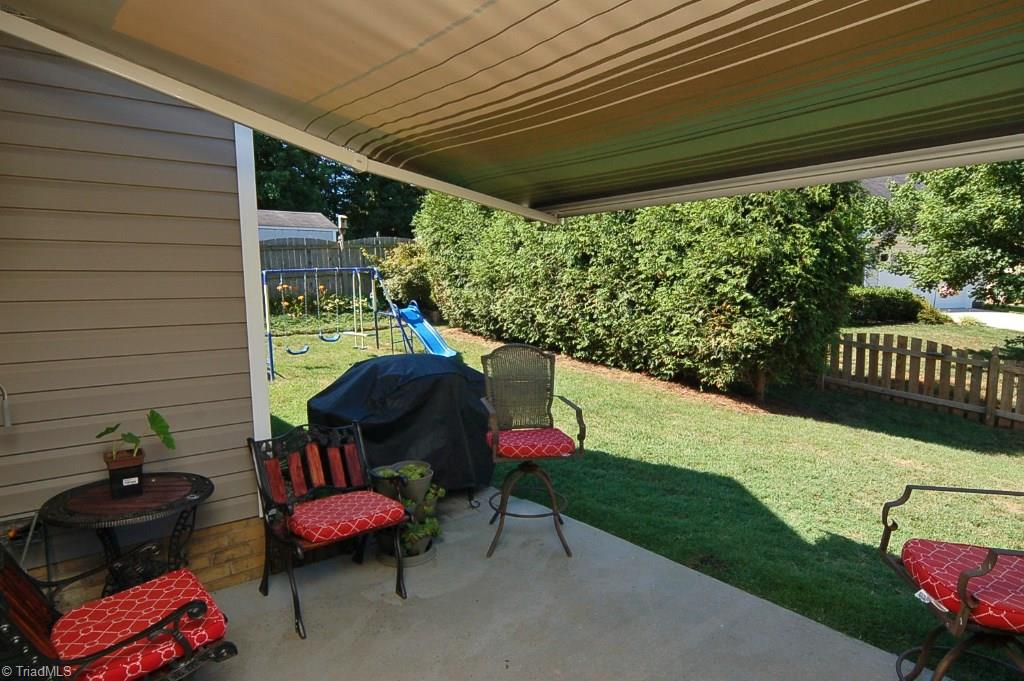 3809 Payne Road High Point, NC 27265 - Photo 25 of 30 Patio space overlooks the fenced backyard.