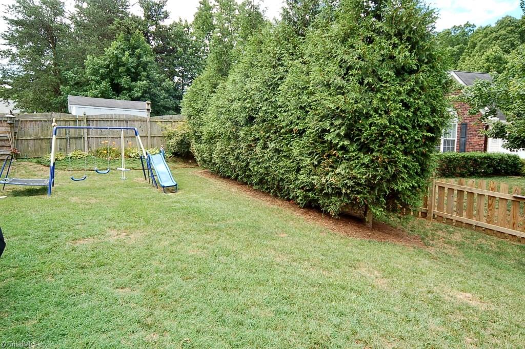 3809 Payne Road High Point, NC 27265 - Photo 28 of 30 Enjoy the fenced backyard with privacy landscaping.