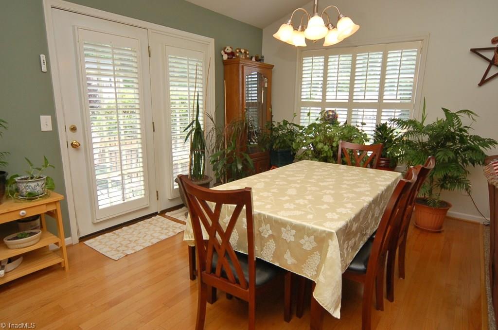 3809 Payne Road High Point, NC 27265 - Photo 8 of 30 Dining room has hardwood floors. Glass doors open onto a spacious patio.