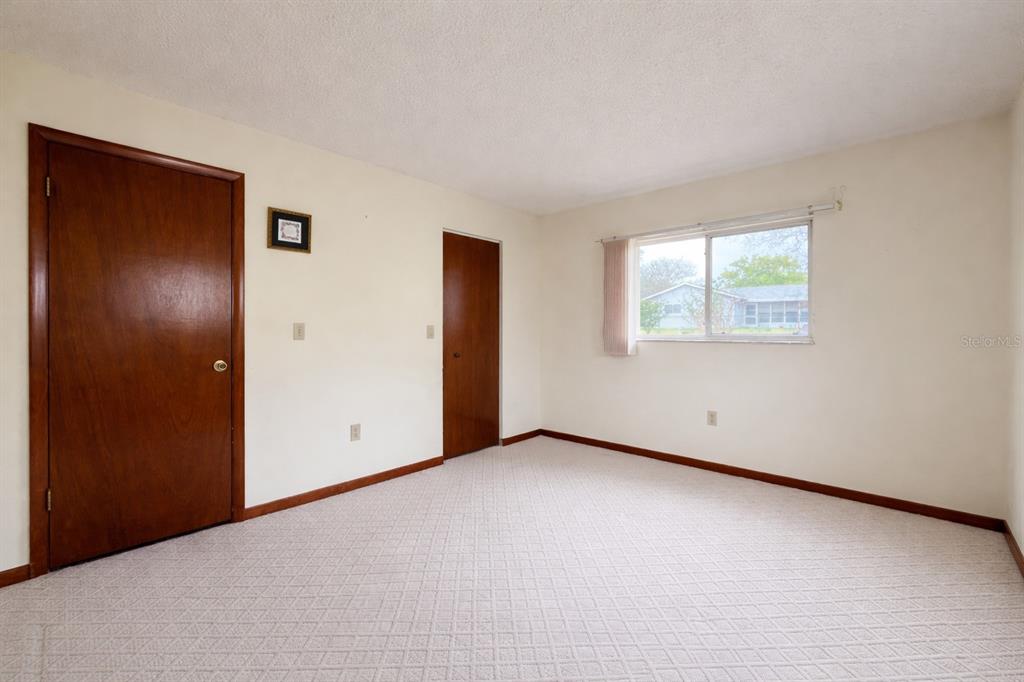 11268 Southwest 75th Terrace Ocala, FL 34476 - Photo 11 of 32 an empty room with windows