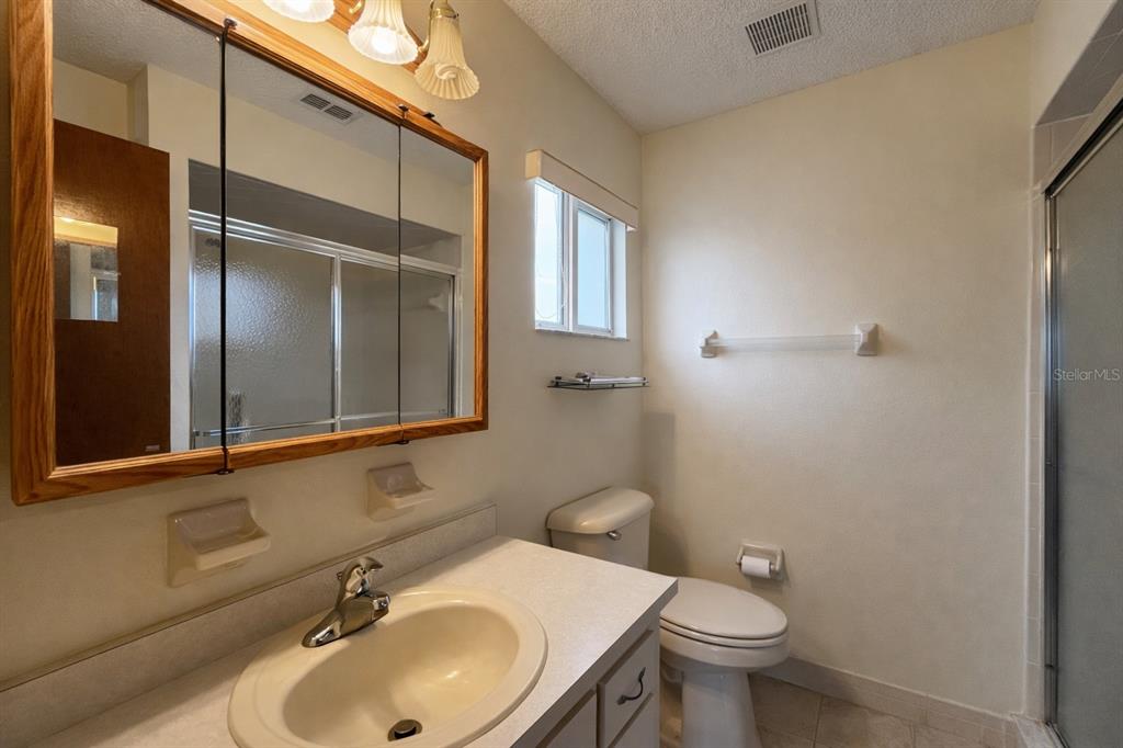 11268 Southwest 75th Terrace Ocala, FL 34476 - Photo 15 of 32 a bathroom with a sink toilet and mirror