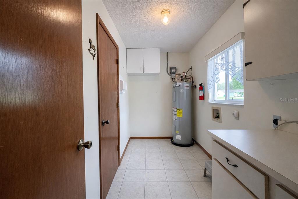 11268 Southwest 75th Terrace Ocala, FL 34476 - Photo 24 of 32 a room with a window and refrigerator