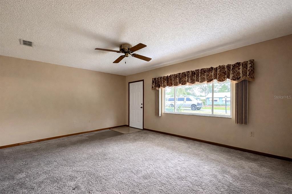11268 Southwest 75th Terrace Ocala, FL 34476 - Photo 6 of 32 a view of an empty room with a window