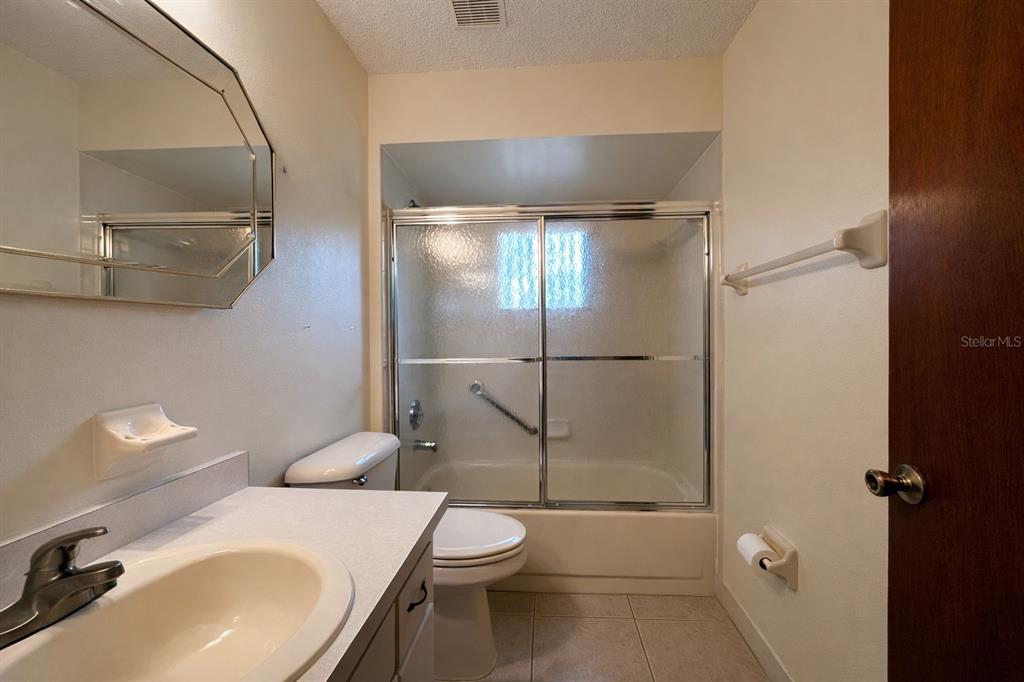 11268 Southwest 75th Terrace Ocala, FL 34476 - Photo 8 of 32 a bathroom with a sink toilet and shower