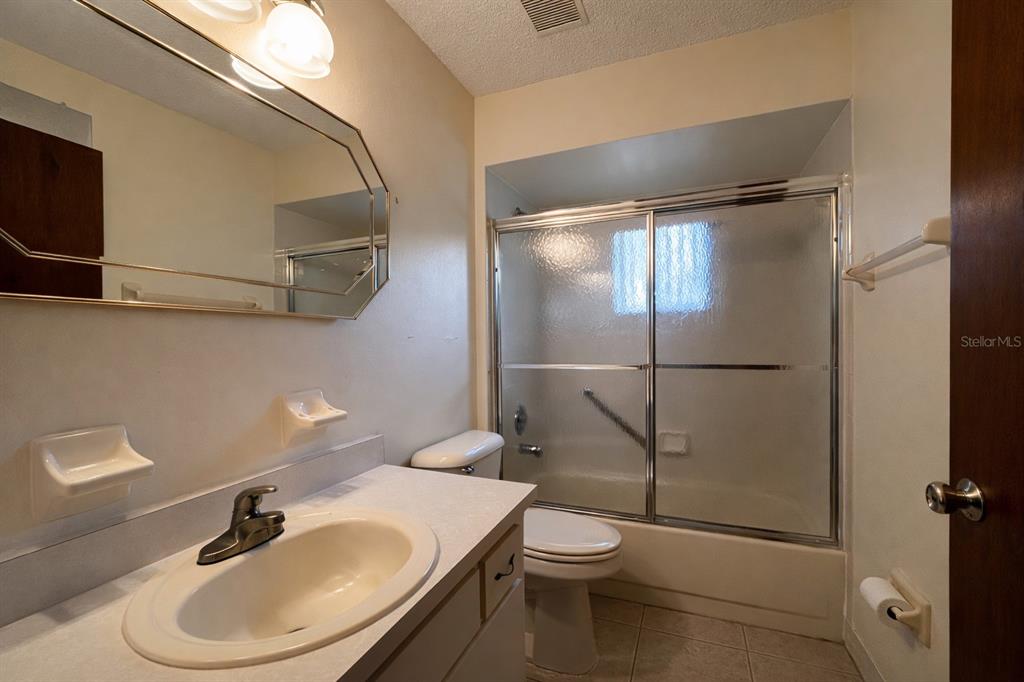 11268 Southwest 75th Terrace Ocala, FL 34476 - Photo 9 of 32 a bathroom with a sink toilet and shower