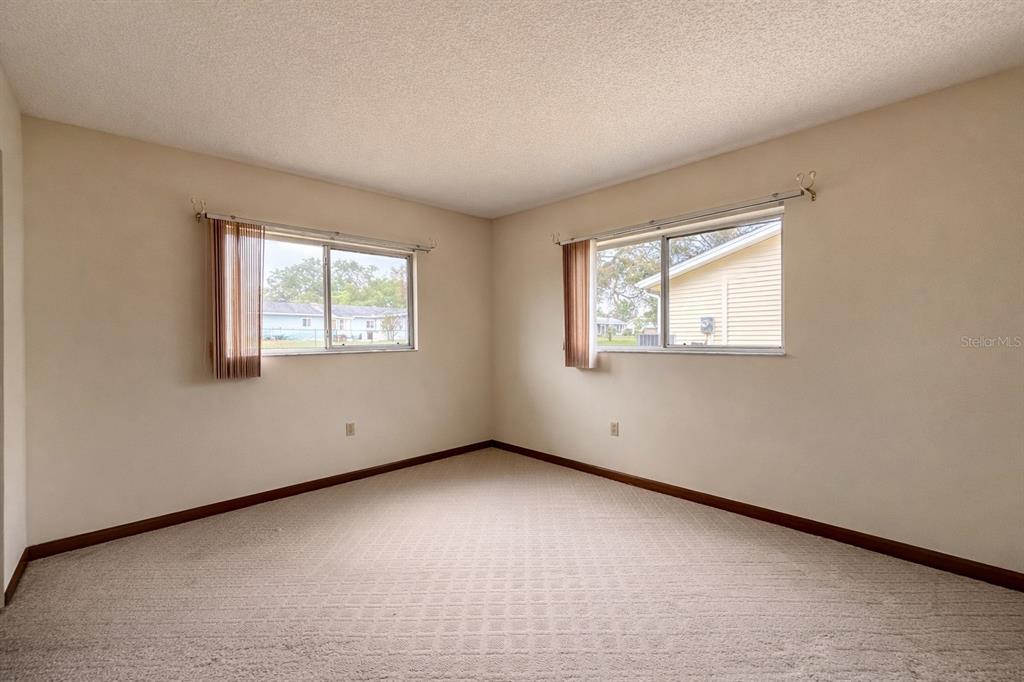 11268 Southwest 75th Terrace Ocala, FL 34476 - Photo 10 of 32 an empty room with windows