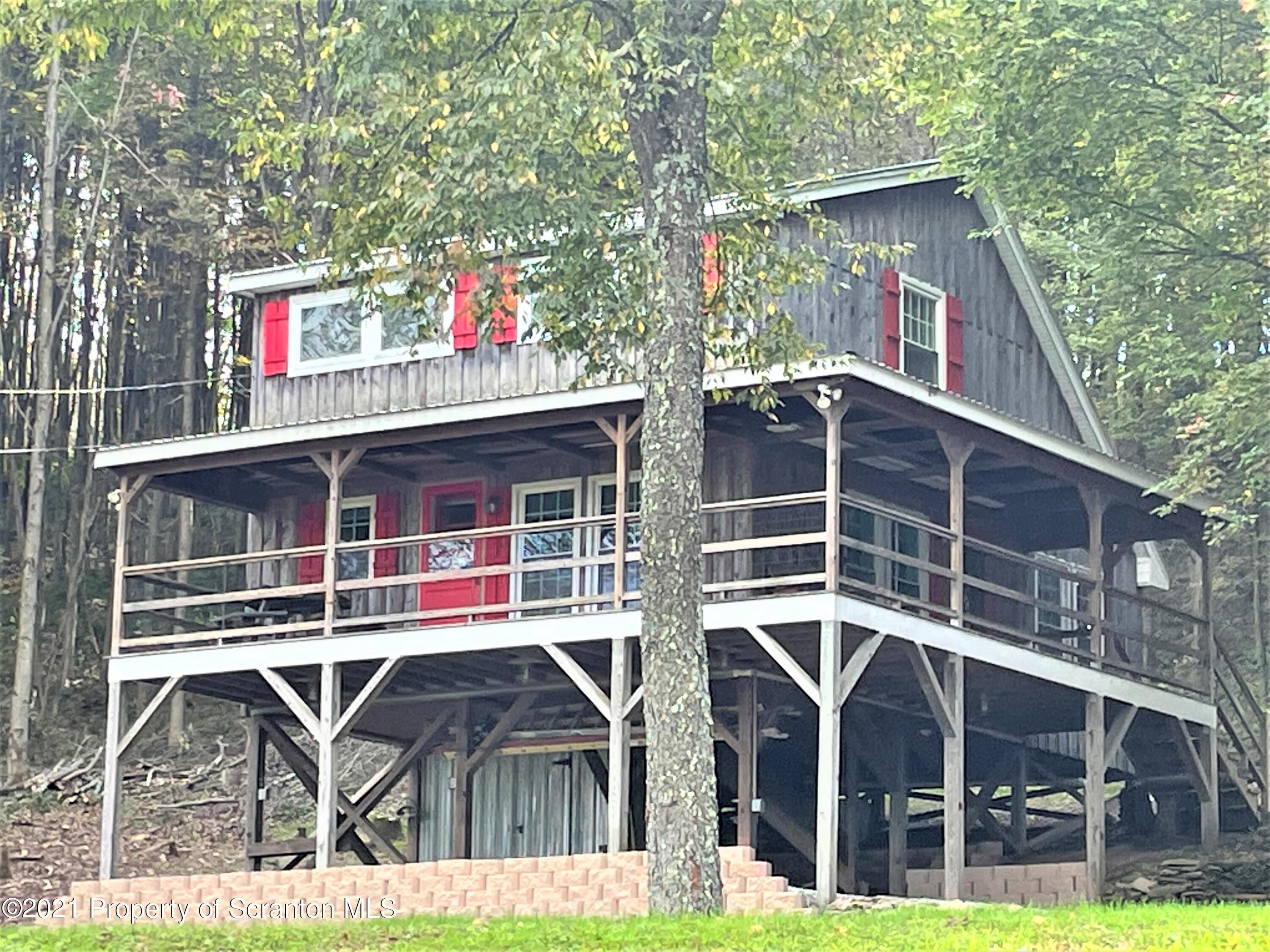 705-771 Hunter Road Springville, PA 18844 - Photo 1 of 62 a view of house with outdoor space and seating area