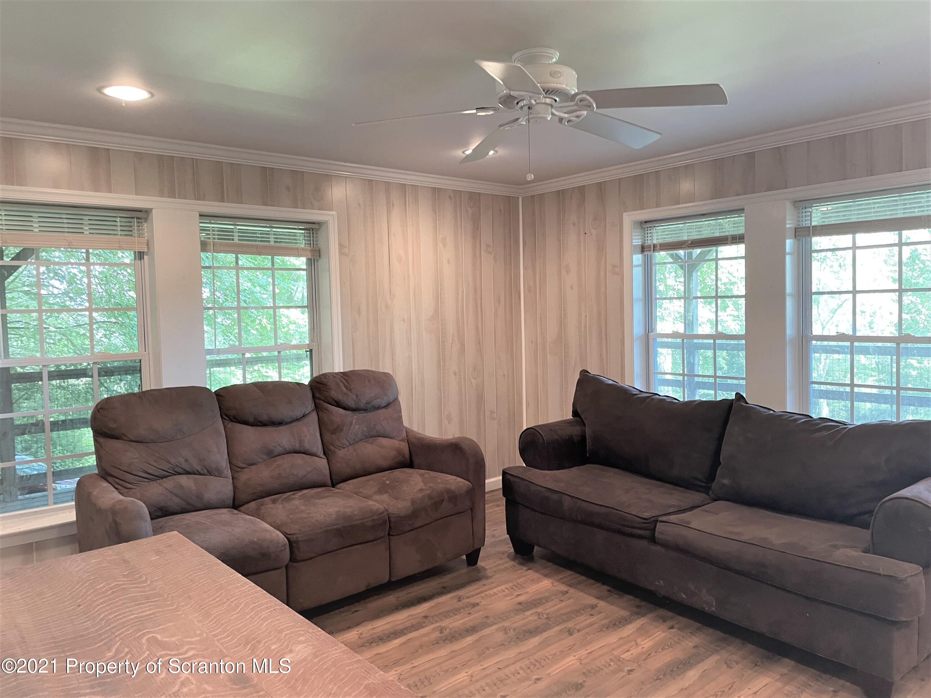 705-771 Hunter Road Springville, PA 18844 - Photo 24 of 62 a living room with furniture and a large window