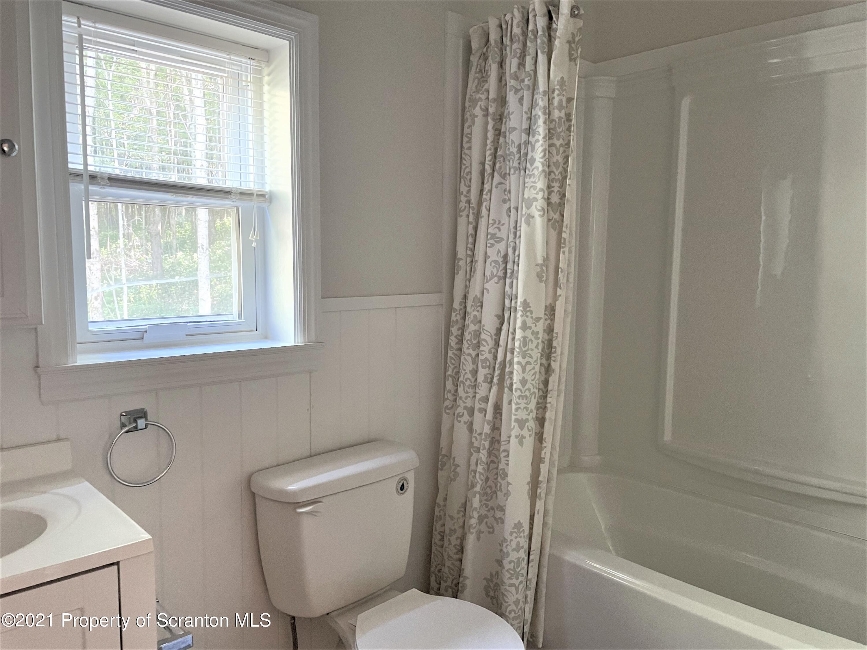 705-771 Hunter Road Springville, PA 18844 - Photo 36 of 62 a bathroom with a toilet a sink and a bathtub