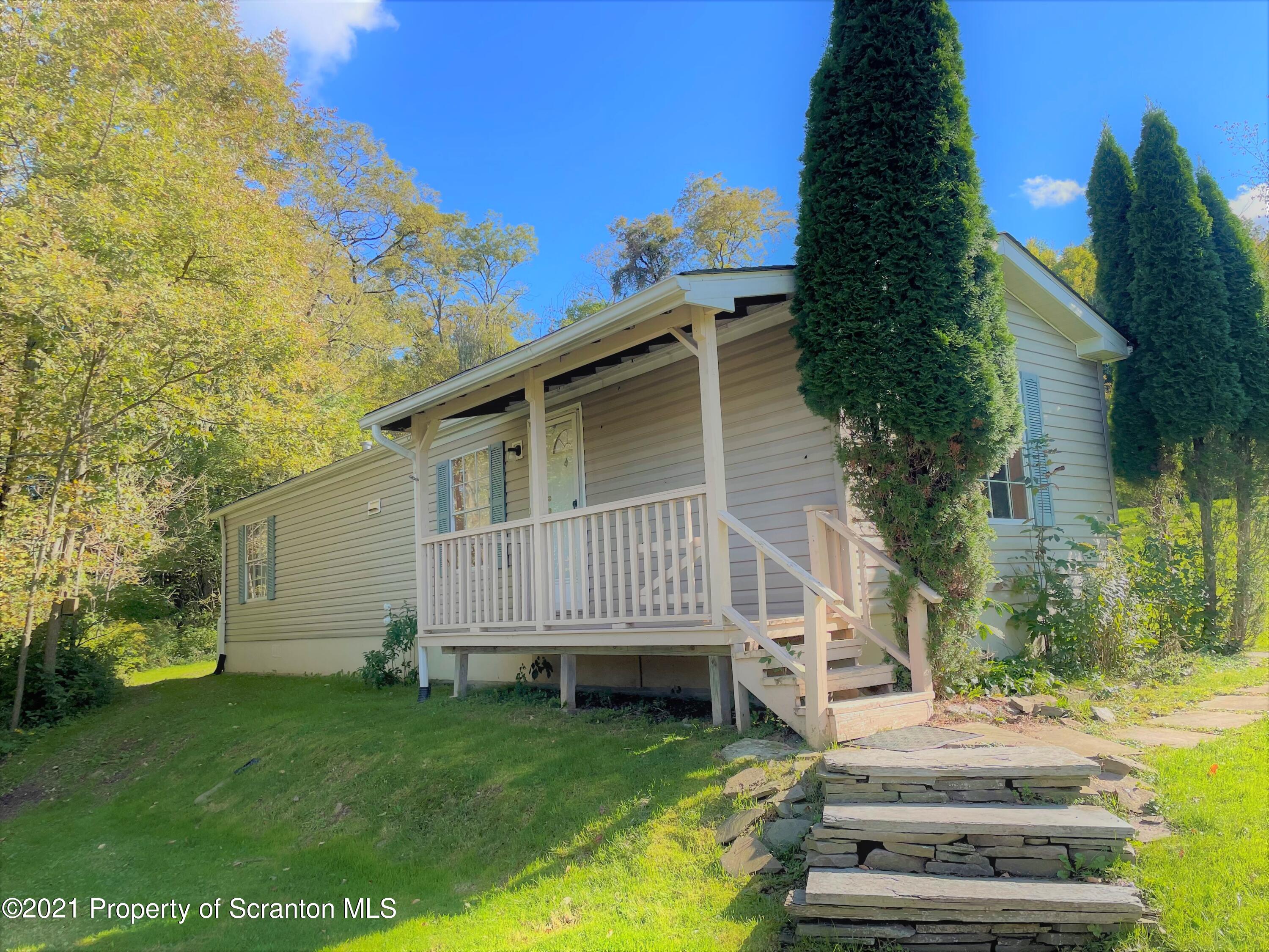 705-771 Hunter Road Springville, PA 18844 - Photo 43 of 62 a view of a house with a yard