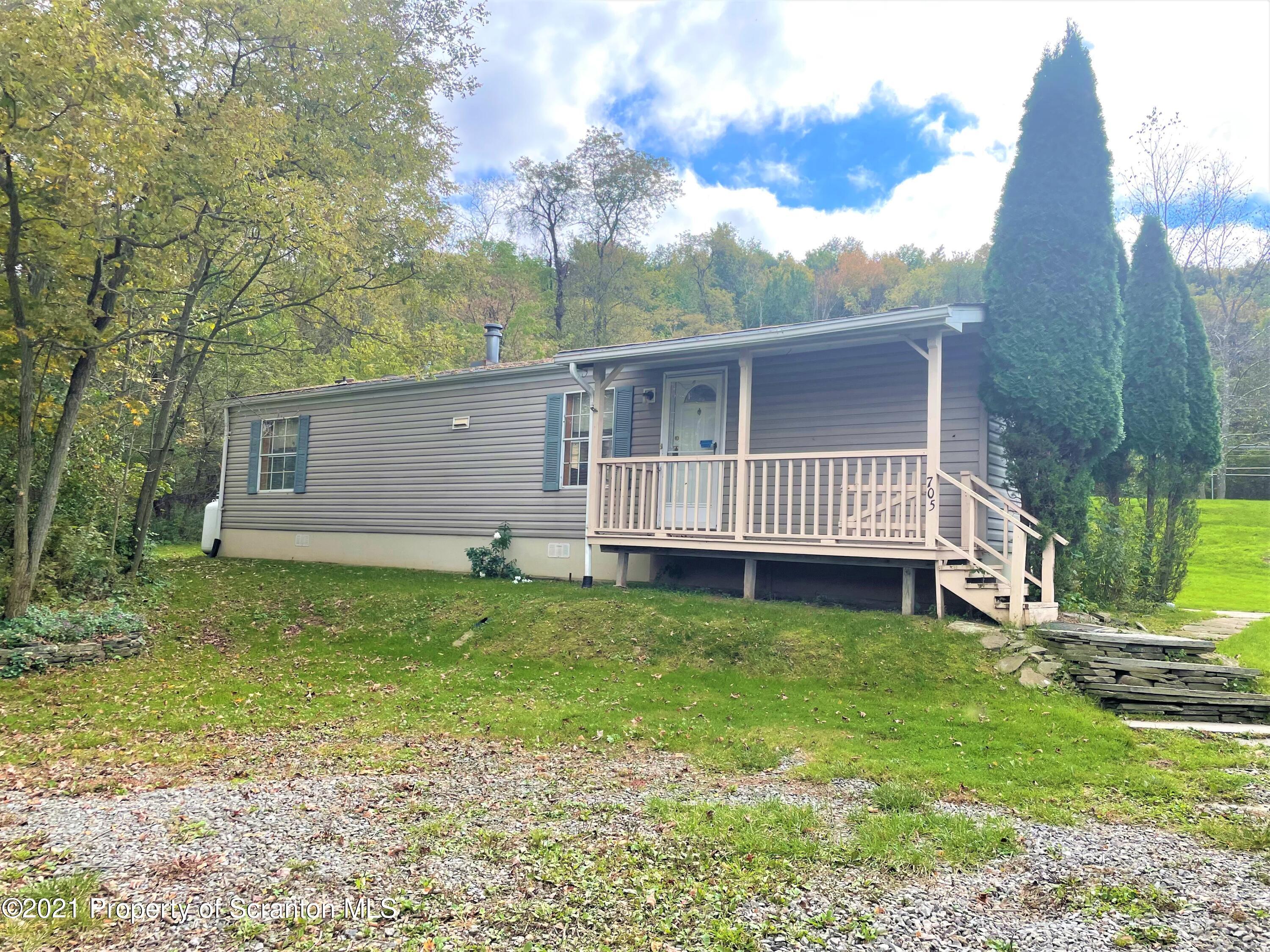 705-771 Hunter Road Springville, PA 18844 - Photo 44 of 62 a view of a house with a yard