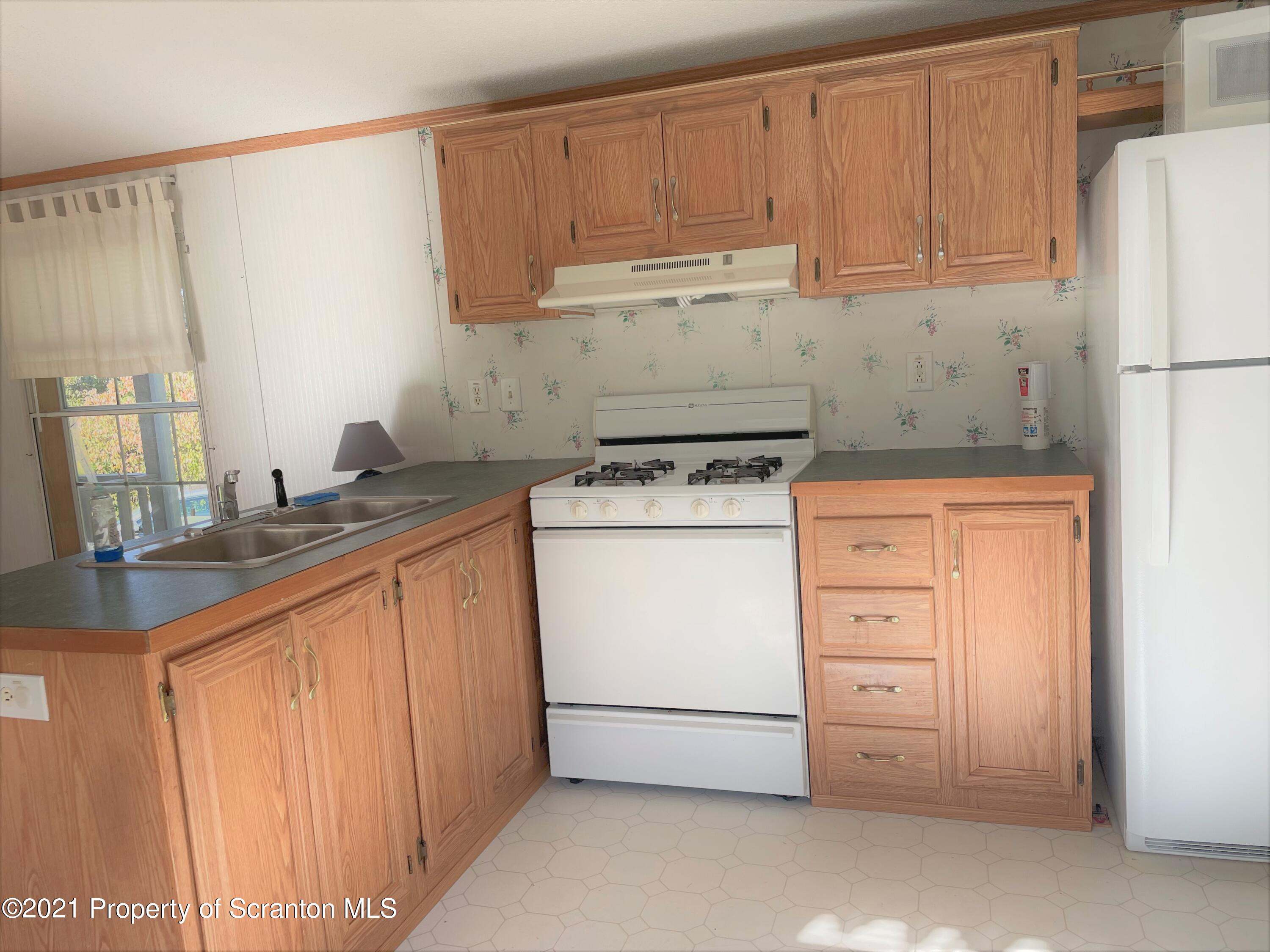 705-771 Hunter Road Springville, PA 18844 - Photo 53 of 62 a utility room with granite countertop cabinets washer and dryer