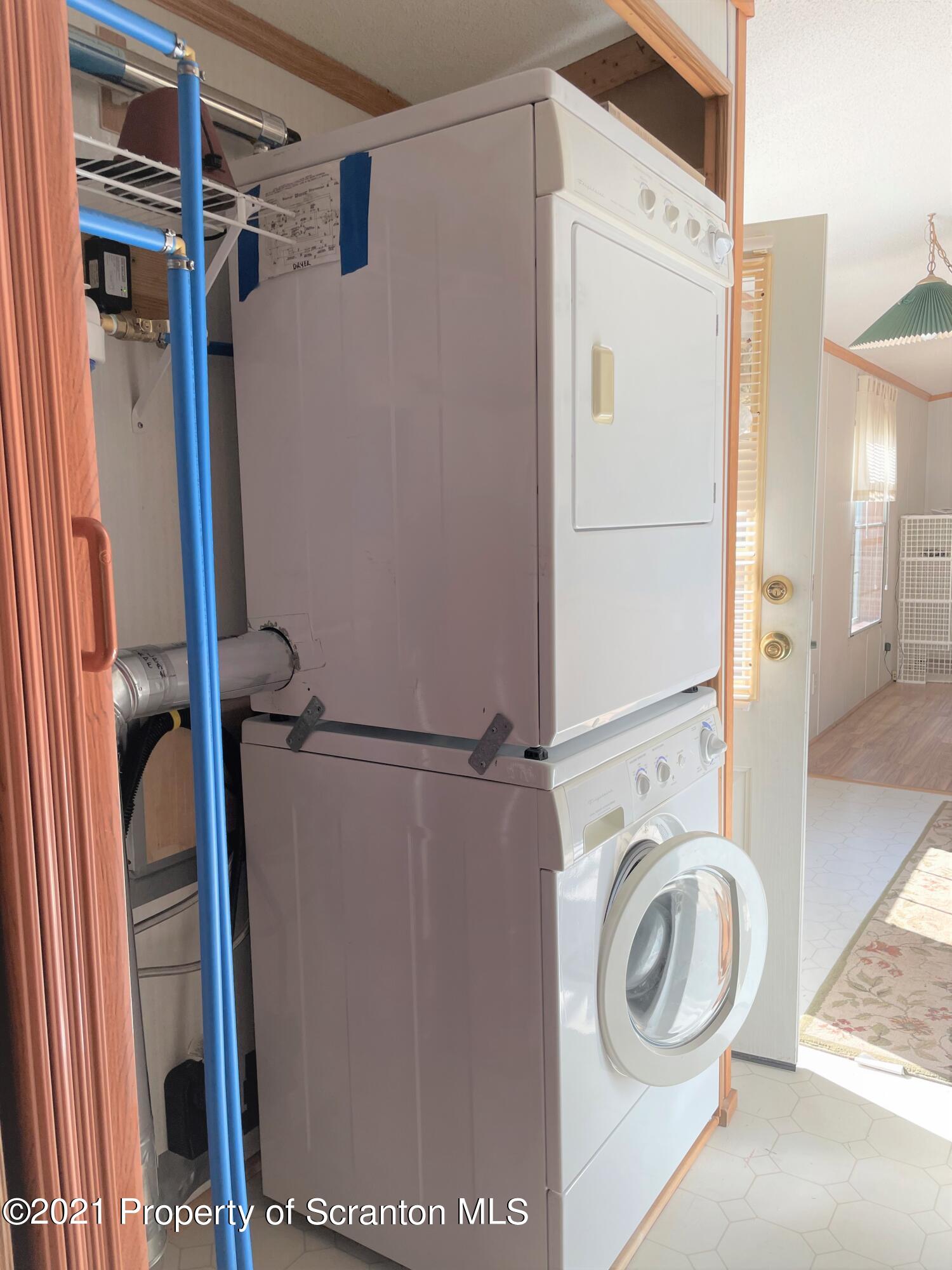 705-771 Hunter Road Springville, PA 18844 - Photo 54 of 62 a utility room with dryer and washer