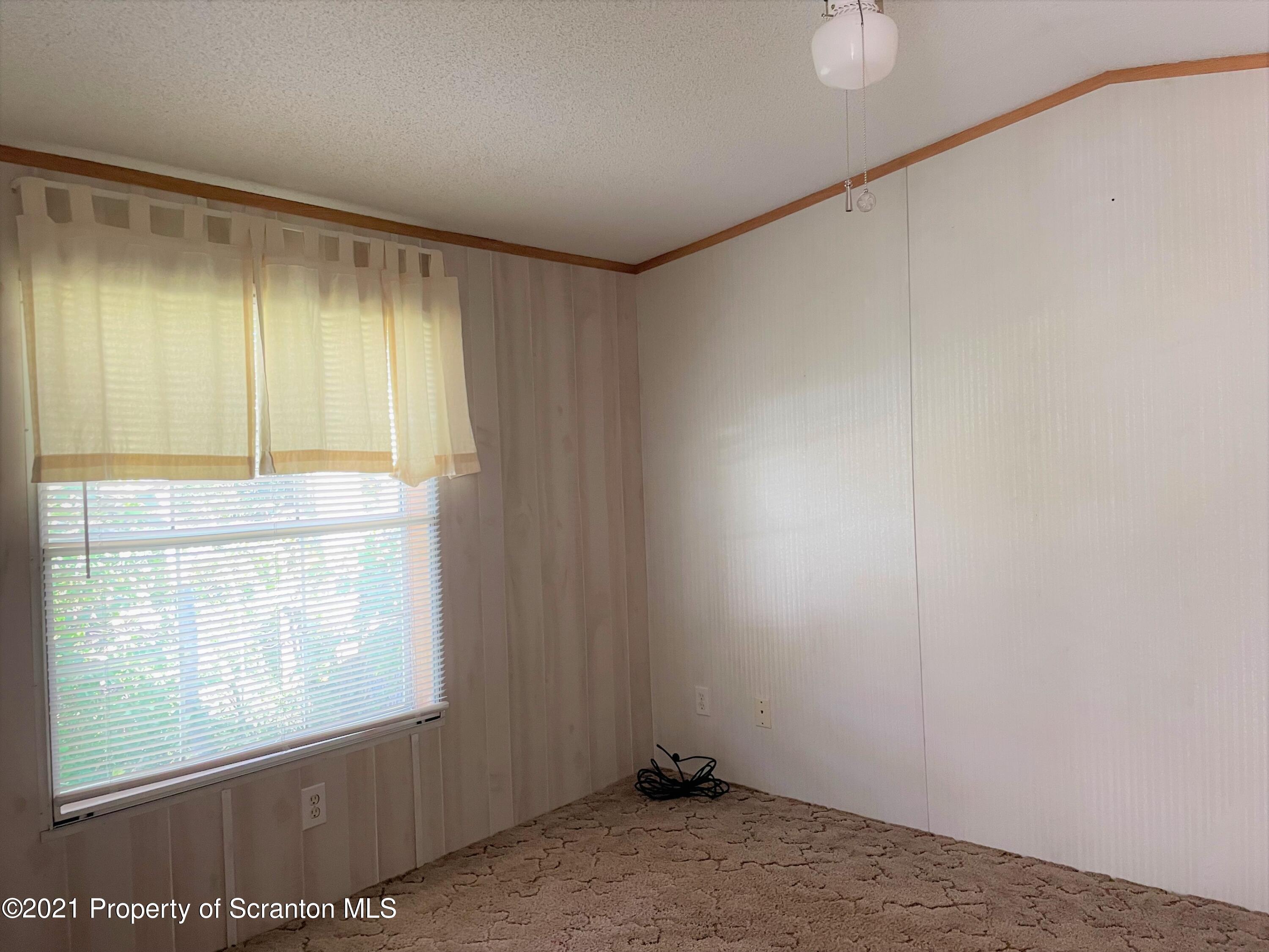 705-771 Hunter Road Springville, PA 18844 - Photo 60 of 62 a view of an empty room and window