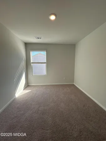 an empty room that has a window