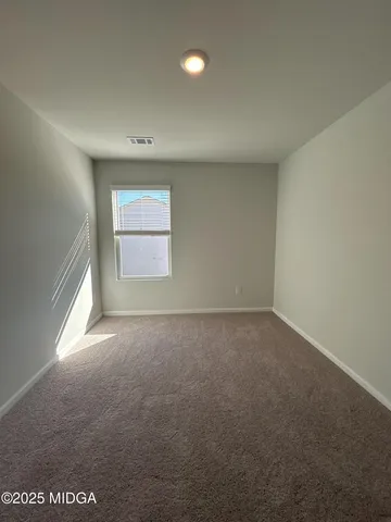 an empty room that has a window