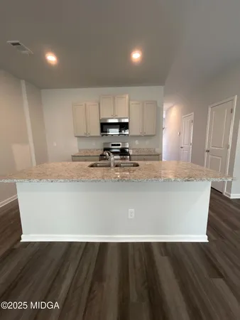 a view of kitchen with wooden floor