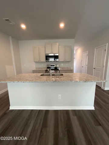 a view of kitchen with wooden floor