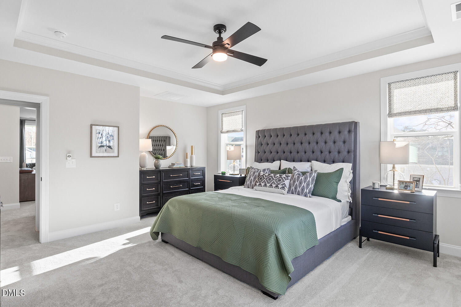 8120 Andrea Lane Raleigh, NC 27613 - Photo 11 of 25 a bedroom with a bed a chandelier and a dresser