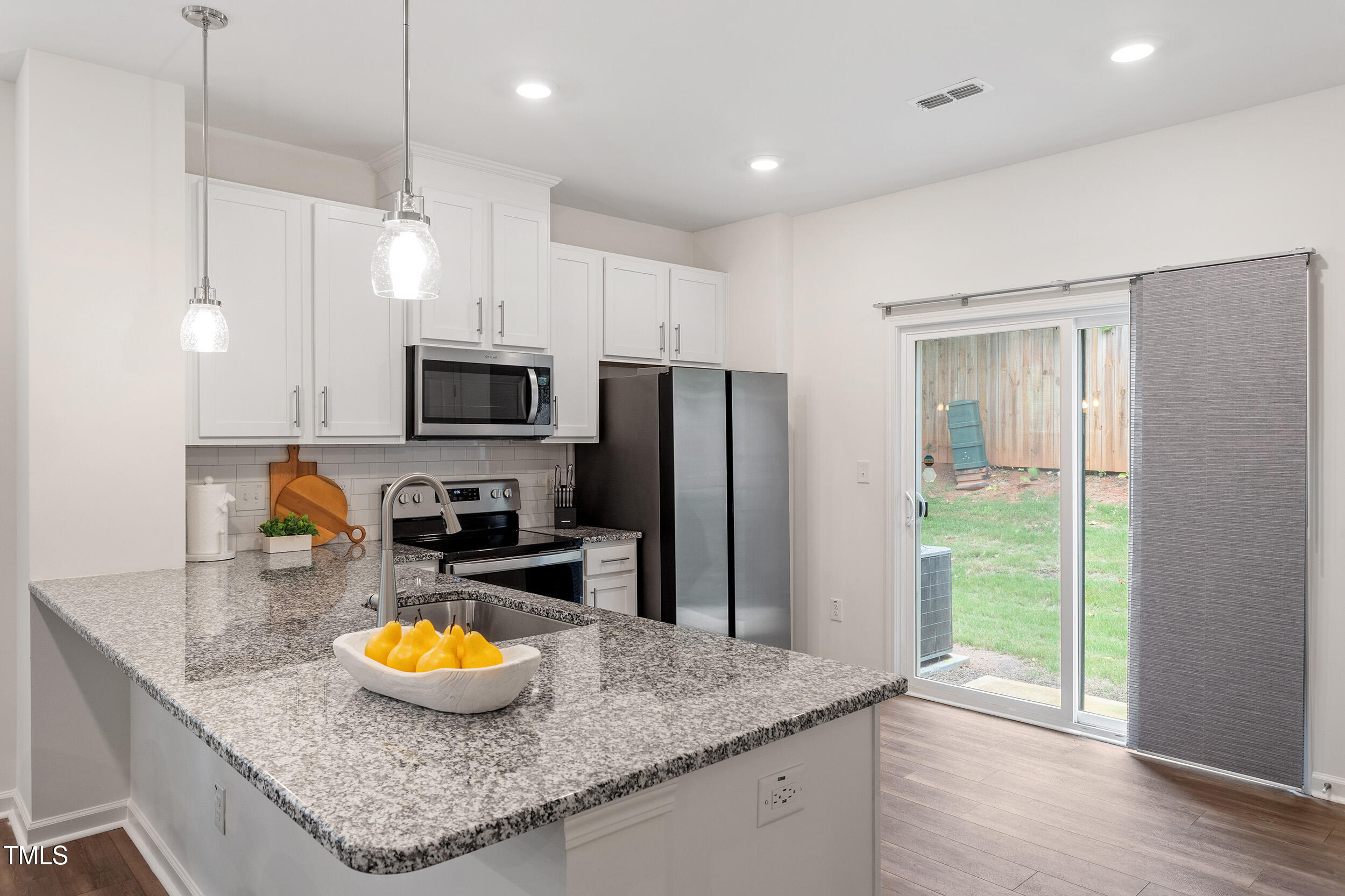 441 Hacksaw Trail Raleigh, NC 27610 - Photo 12 of 29 a kitchen with refrigerator and microwave