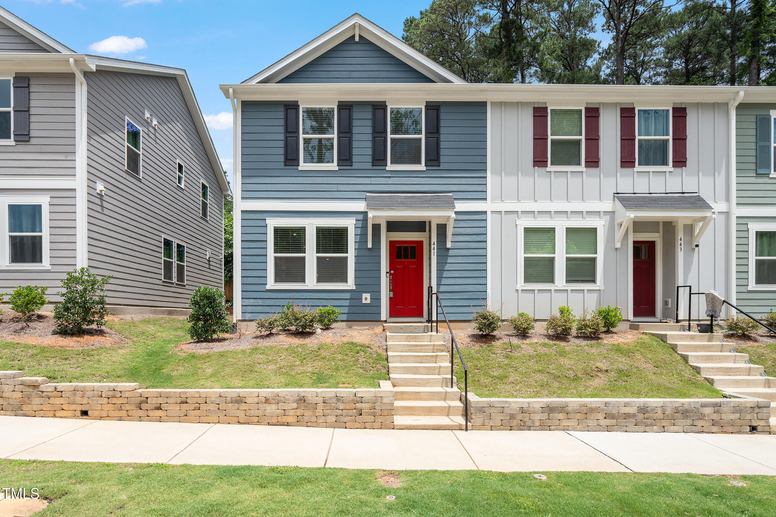441 Hacksaw Trail Raleigh, NC 27610 - Photo 2 of 29 a view of a yard in front of a brick house