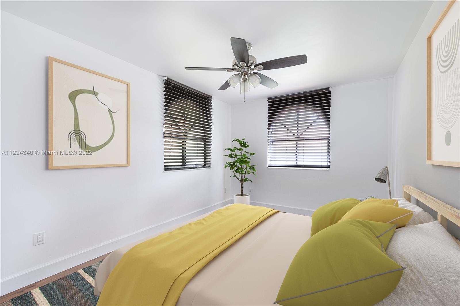 14442 Southwest 111th Street Miami, FL 33186 - Photo 13 of 15 a bedroom with a bed and a window