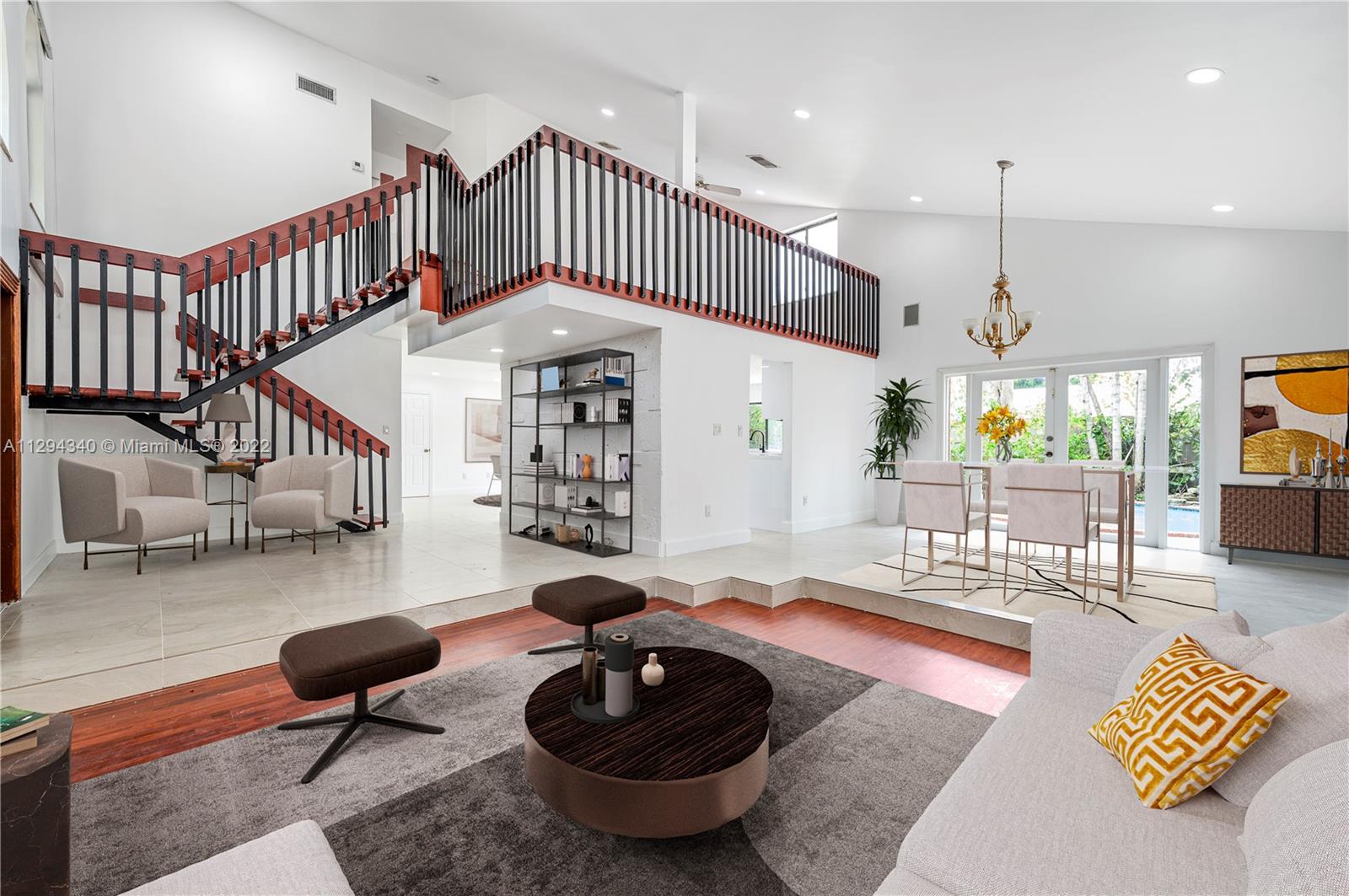 14442 Southwest 111th Street Miami, FL 33186 - Photo 6 of 15 a living room with lots of furniture and a rug